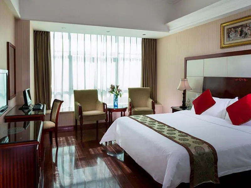 Bed in Vienna Hotel Shenzhen Yousong Branch