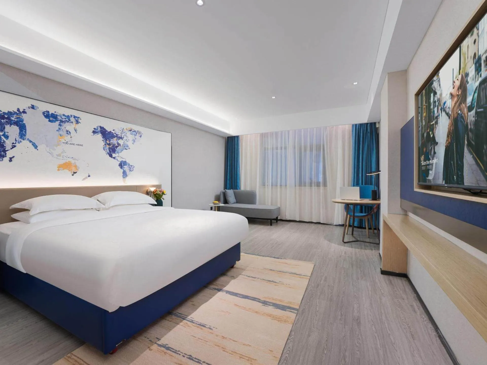 Bed in Kyriad Hotel Baoying Jinyuan Square High-speed Railway Station