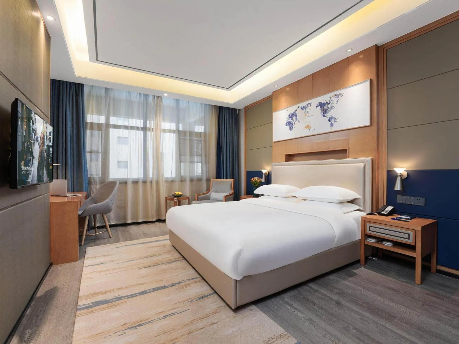 Bed in Kyriad Hotel Baoying Jinyuan Square High-speed Railway Station