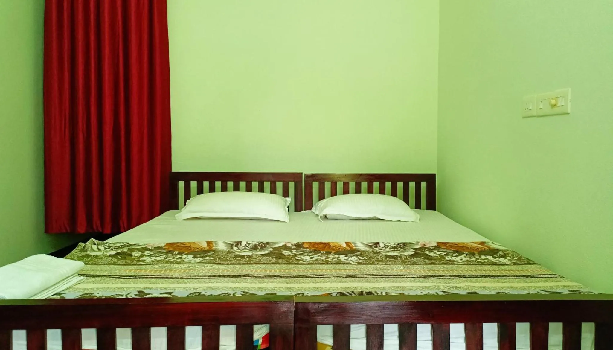 Bed in Angels' homestay Marari