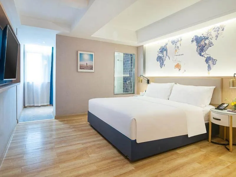 Bed in Kyriad Marvelous Hotel Dongguan Changan Light Rail Station