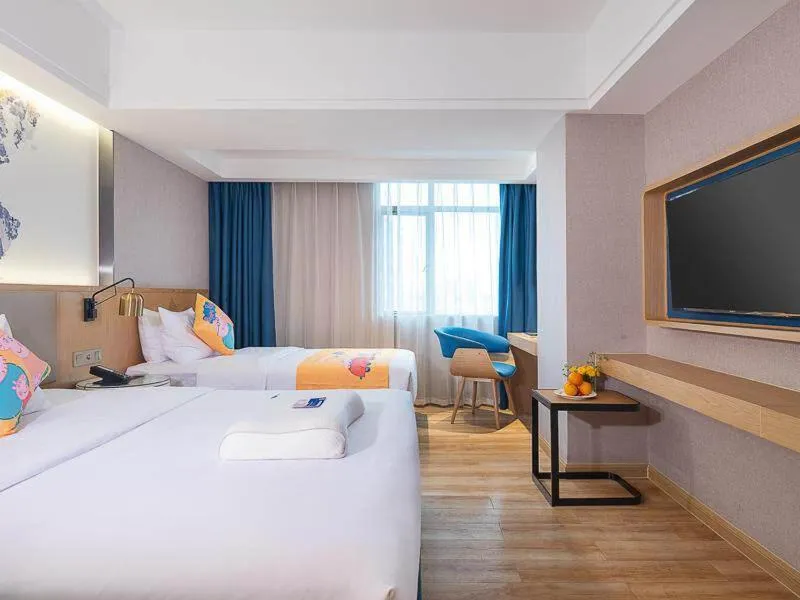 Bed in Kyriad Marvelous Hotel Dongguan Changan Light Rail Station