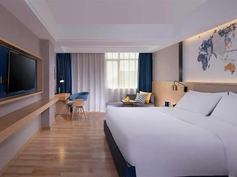 Bed in Kyriad Marvelous Hotel Dongguan Changan Light Rail Station
