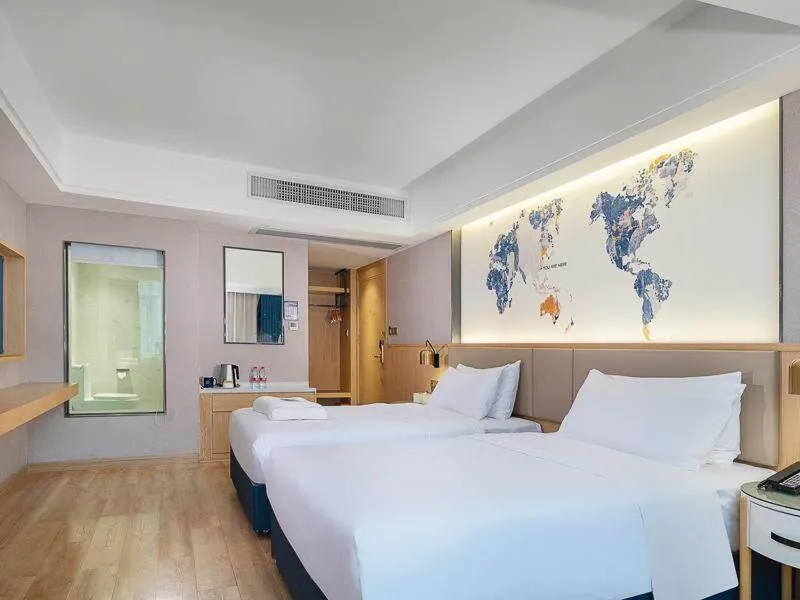 Bed in Kyriad Marvelous Hotel Dongguan Changan Light Rail Station