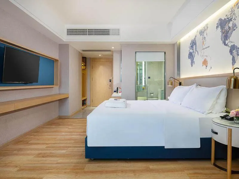Bed in Kyriad Marvelous Hotel Dongguan Changan Light Rail Station