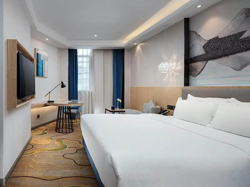 Bed in Kyriad Marvelous Hotel Shenzhen North Railway Station Yousong