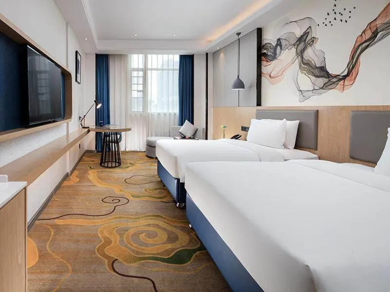 Bed in Kyriad Marvelous Hotel Shenzhen North Railway Station Yousong