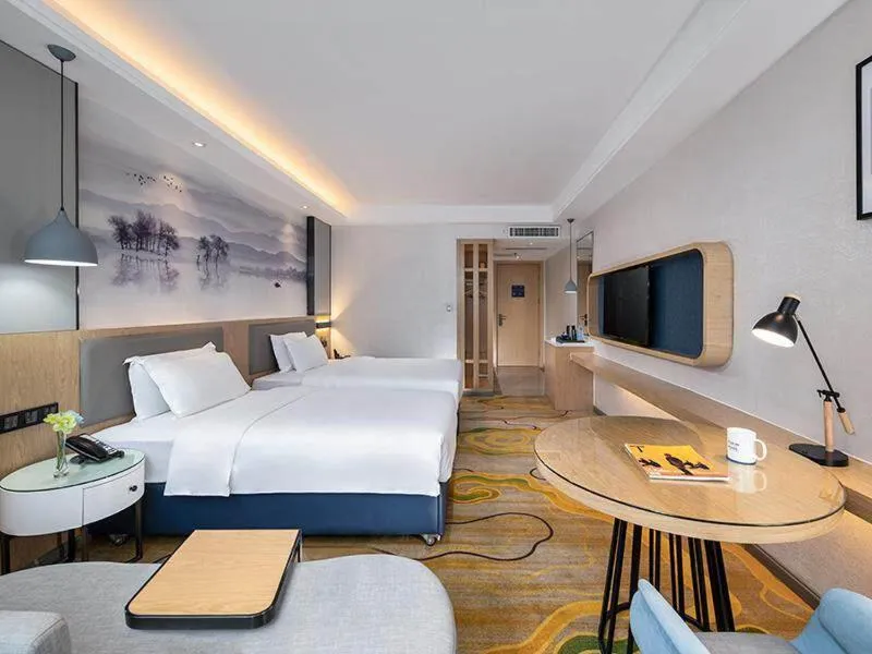 Bed in Kyriad Marvelous Hotel Shenzhen North Railway Station Yousong