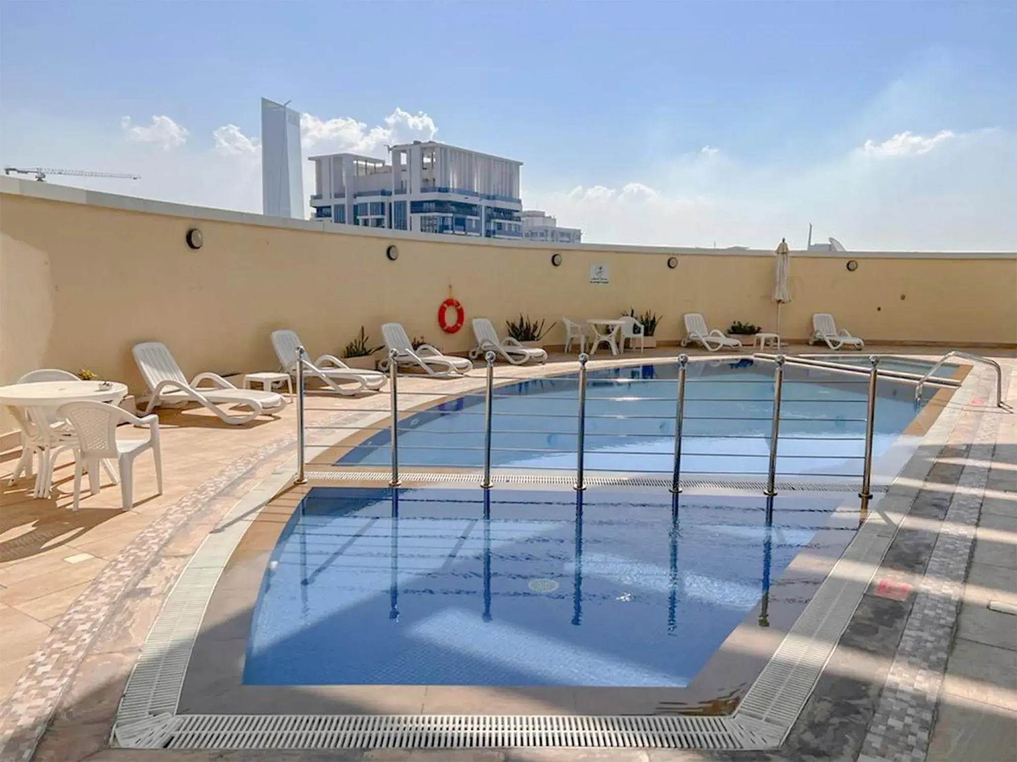 Swimming pool in Cosmos Living Luxurious Studio Near Metro Swimming pool in Cosmos Living Luxurious Studio Near Metro