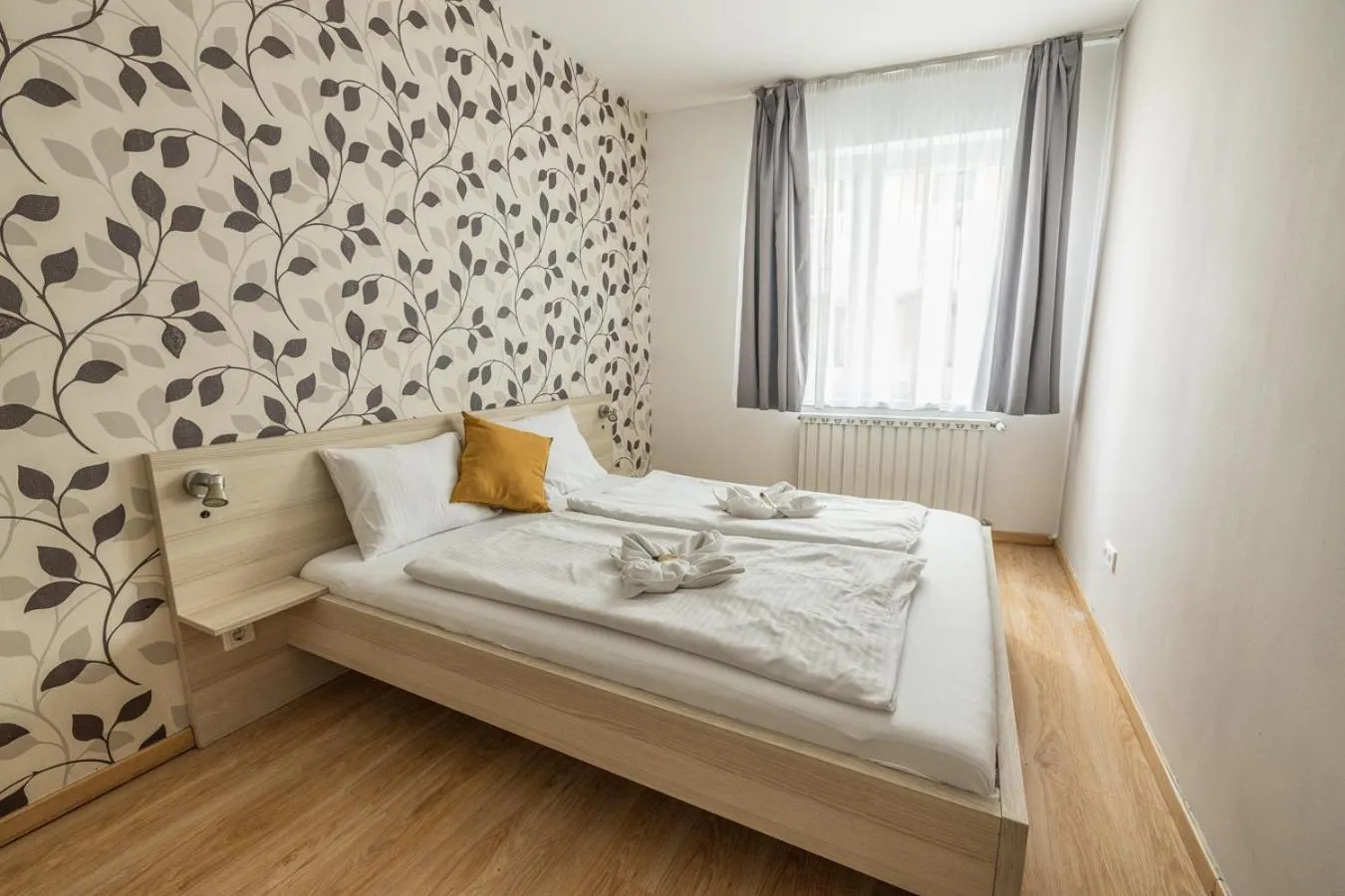 Bed in Maple Tree Budget Apartments