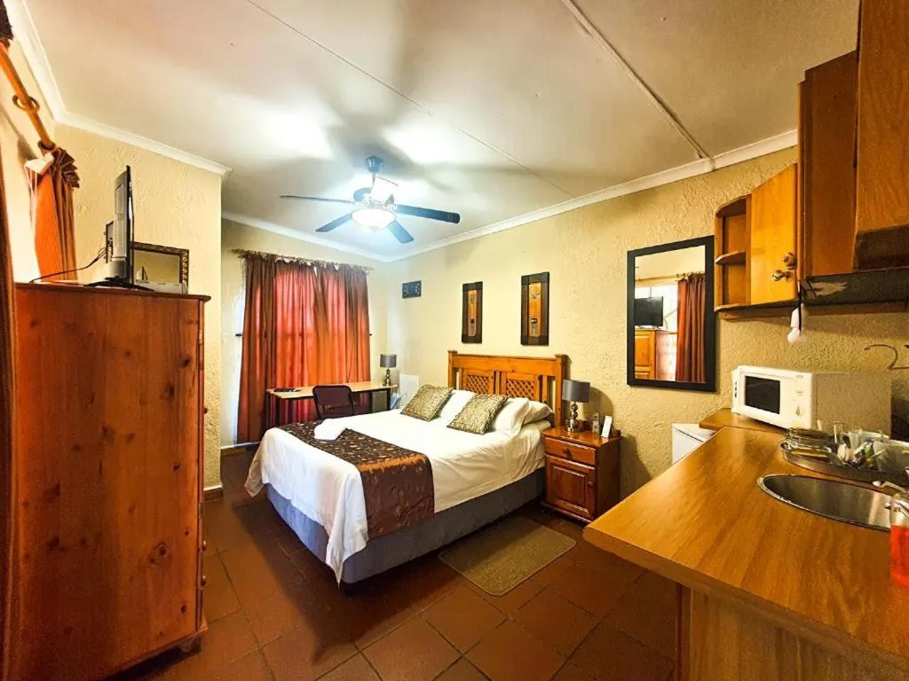 Bed in Just Tiffany Guest House & Conference Facility