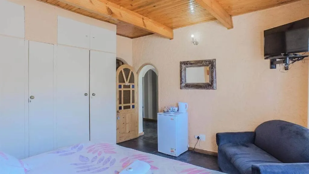 Bed in Just Tiffany Guest House & Conference Facility