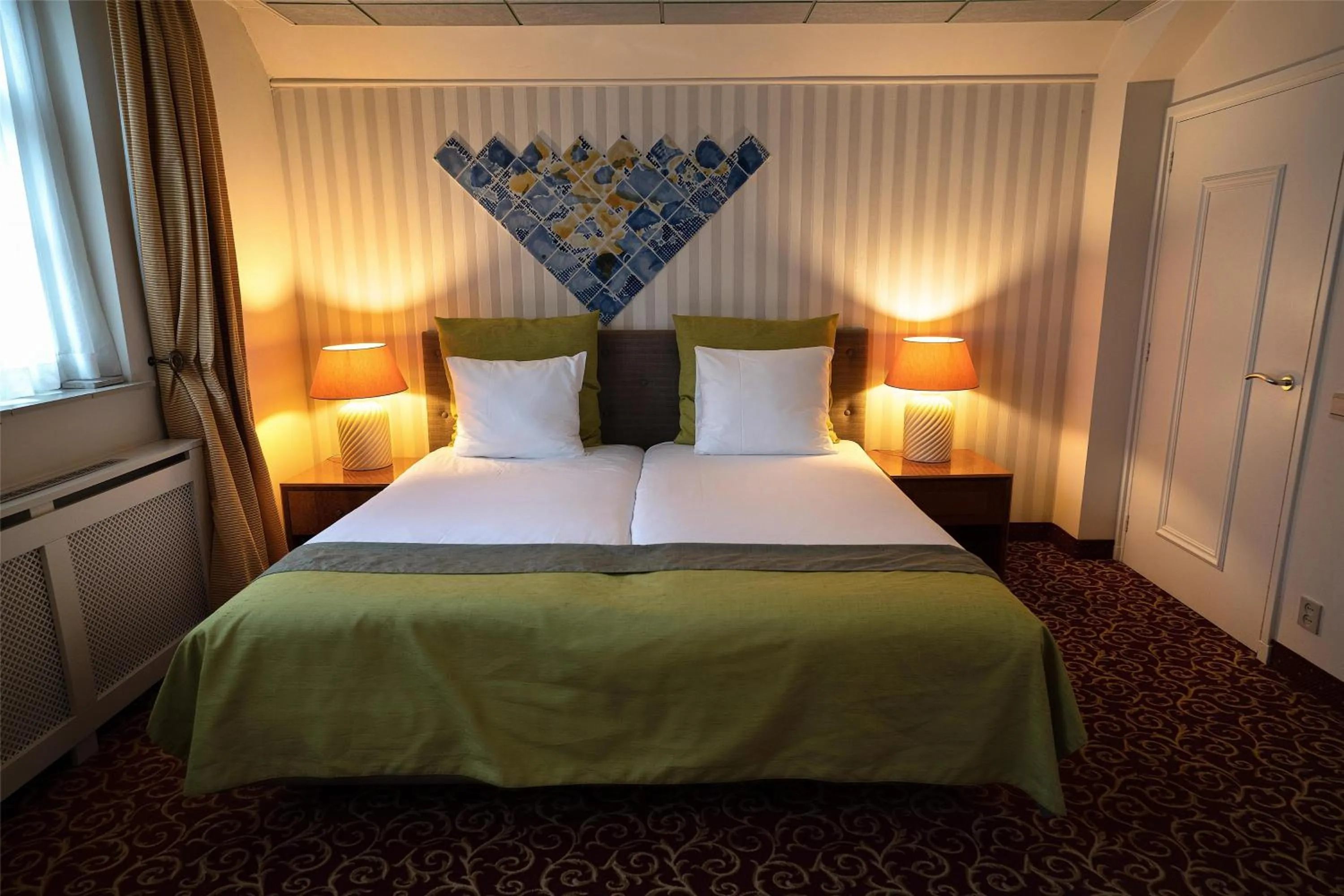 Photo of the whole room, Bed in Grand Museum Hotel, BW Signature Collection