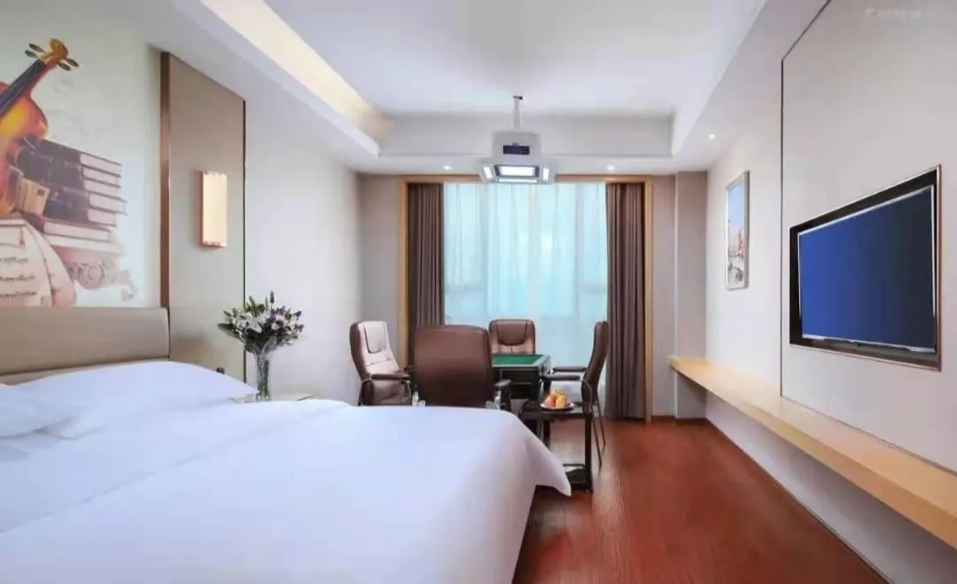 Bed in Vienna International Hotel Nanchang Qingshan Lake Wanda Plaza
