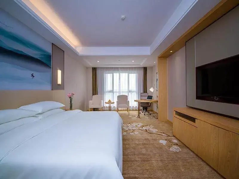 Bed in Vienna International Hotel Yichang Gezhouba Sanxia Culture Tiandi Bed in Vienna International Hotel Yichang Gezhouba Sanxia Culture Tiandi