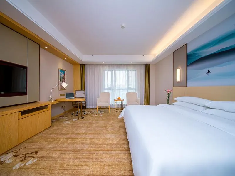 Bed in Vienna International Hotel Yichang Gezhouba Sanxia Culture Tiandi