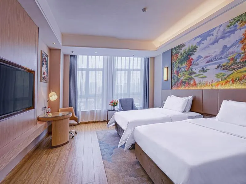 Bed in Vienna International Hotel Chongqing Ranjiaba