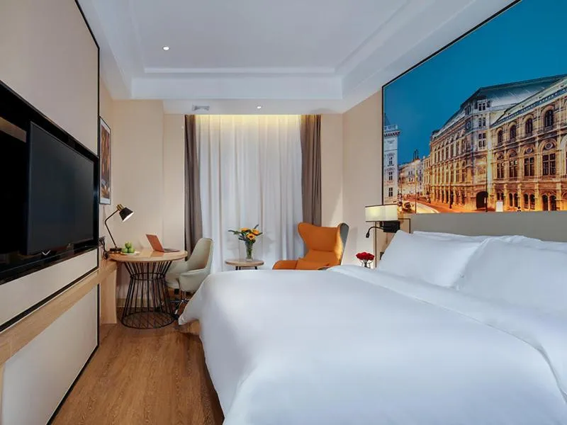 Bed in Vienna International Hotel Chongqing North Station