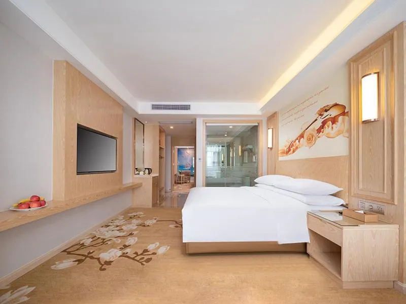 Bed in Vienna International Hotel Chongqing Yuanyangyuanboyuan