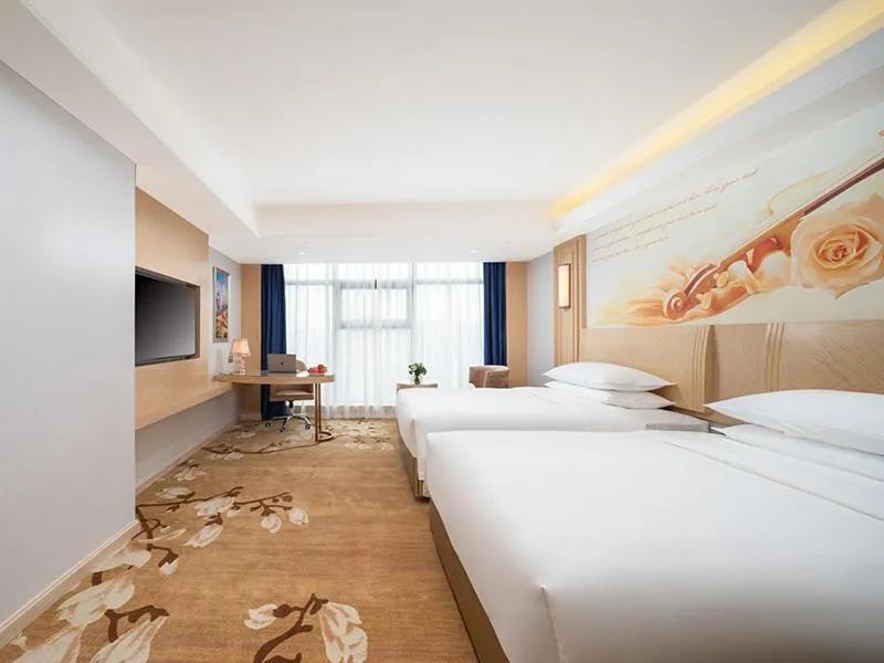 Bed in Vienna International Hotel Chongqing Yuanyangyuanboyuan