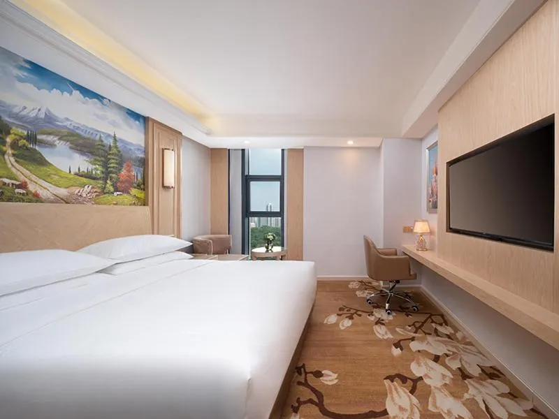 Bed in Vienna International Hotel Chongqing Yuanyangyuanboyuan