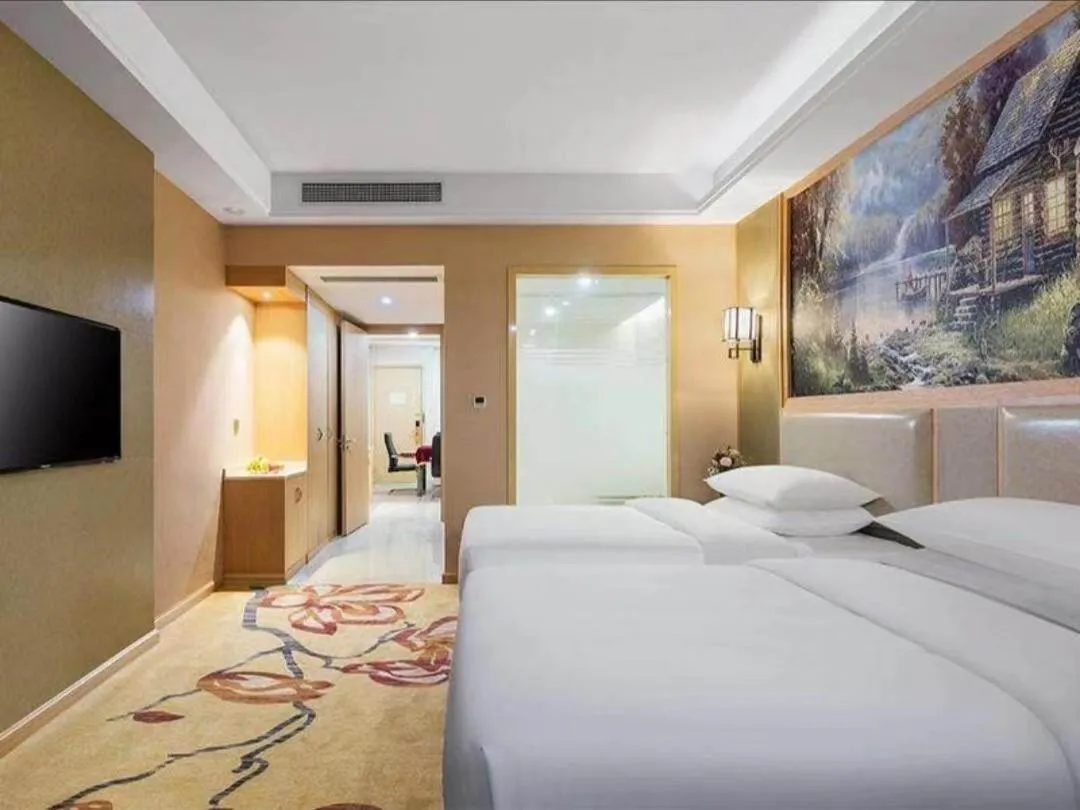 Bed in Vienna International Hotel Zhejiang Wenzhou Ruian Tangxia