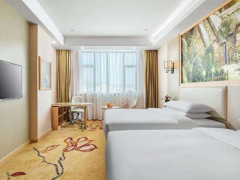 Bed in Vienna International Hotel Zhejiang Wenzhou Ruian Tangxia