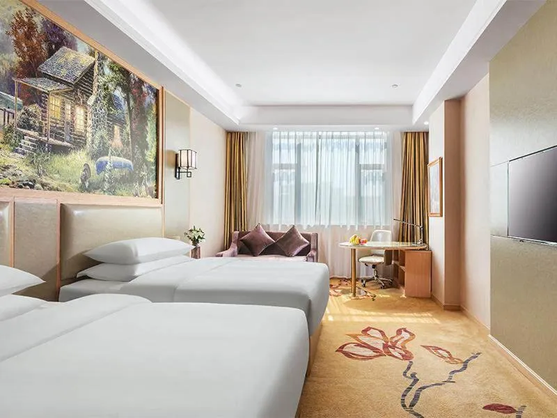 Bed in Vienna International Hotel Zhejiang Wenzhou Ruian Tangxia