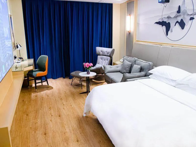 Bed in Vienna International Hotel Jiangsu Wuxi Jiangyin Sports Center