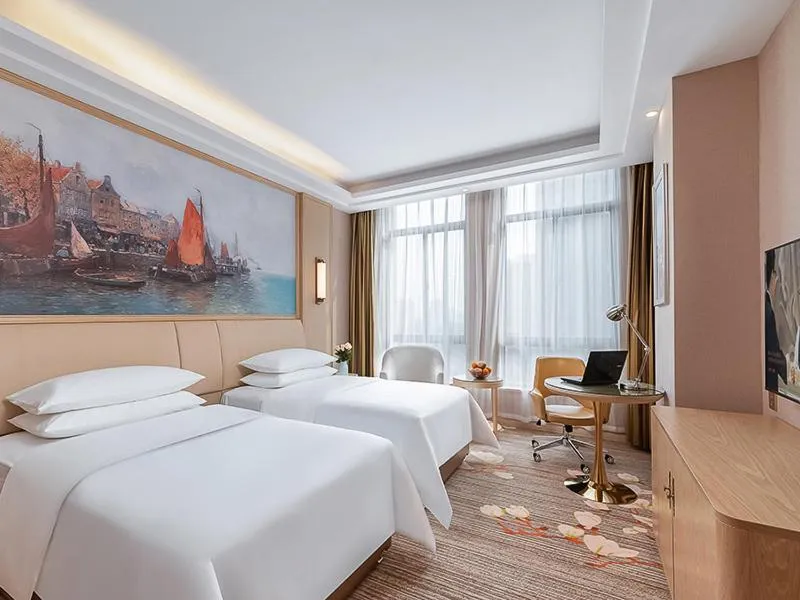 Bed in Vienna Hotel Danyang Glasses City High Speed Railway Station Dabo