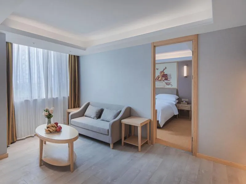 Bed in Vienna Hotel Yangzhou Gaoyou Dongfangyujing