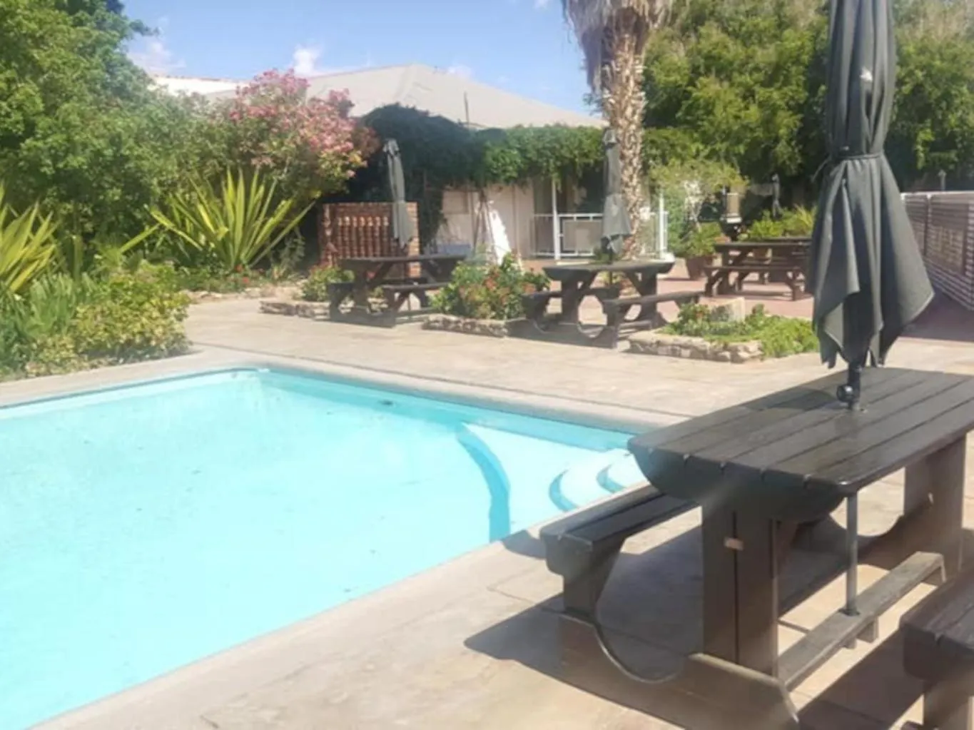 Swimming pool in Pofadder Hotel by Country Hotels