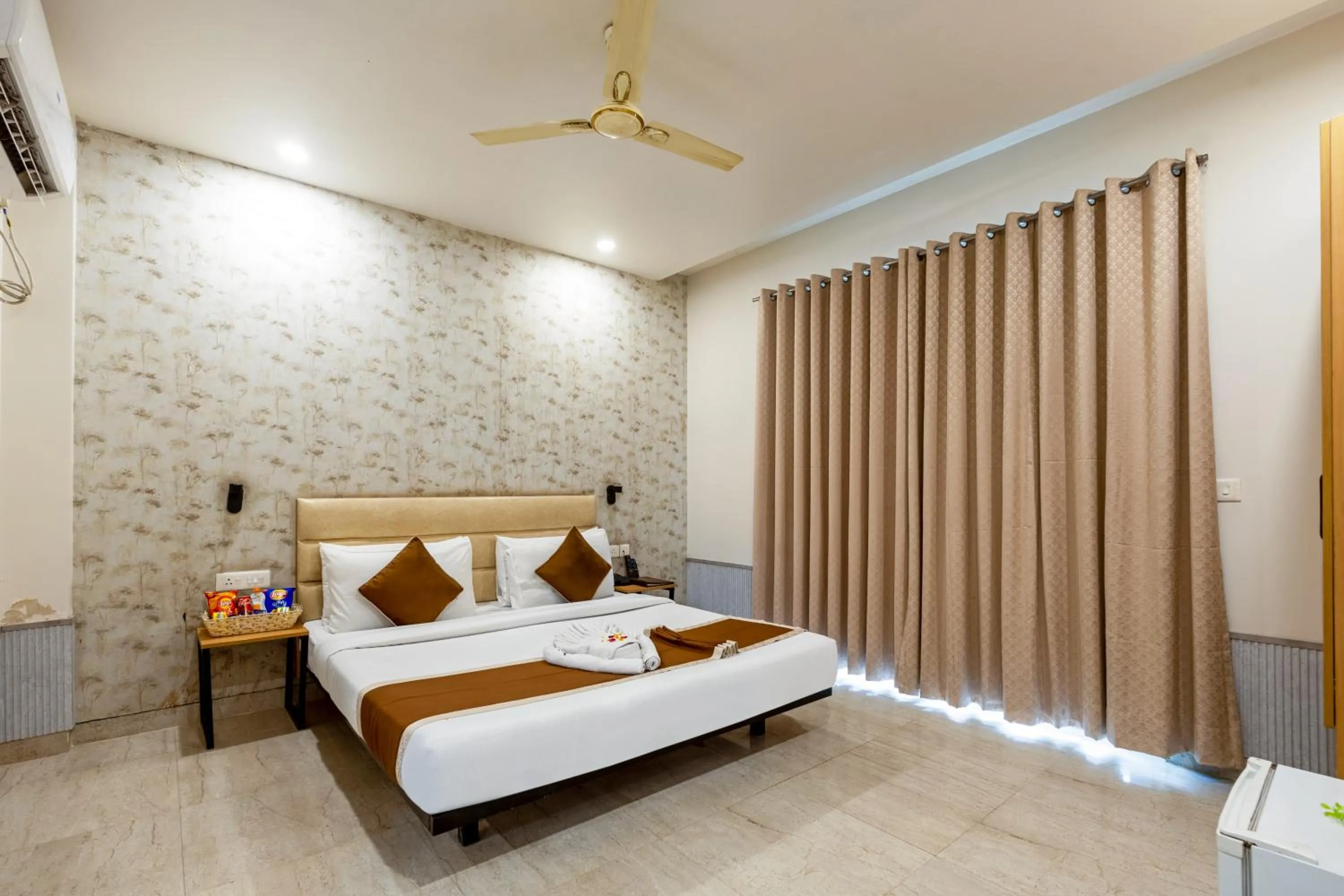 Bed in Aadat Hotel Subhash Chowk Gurgaon