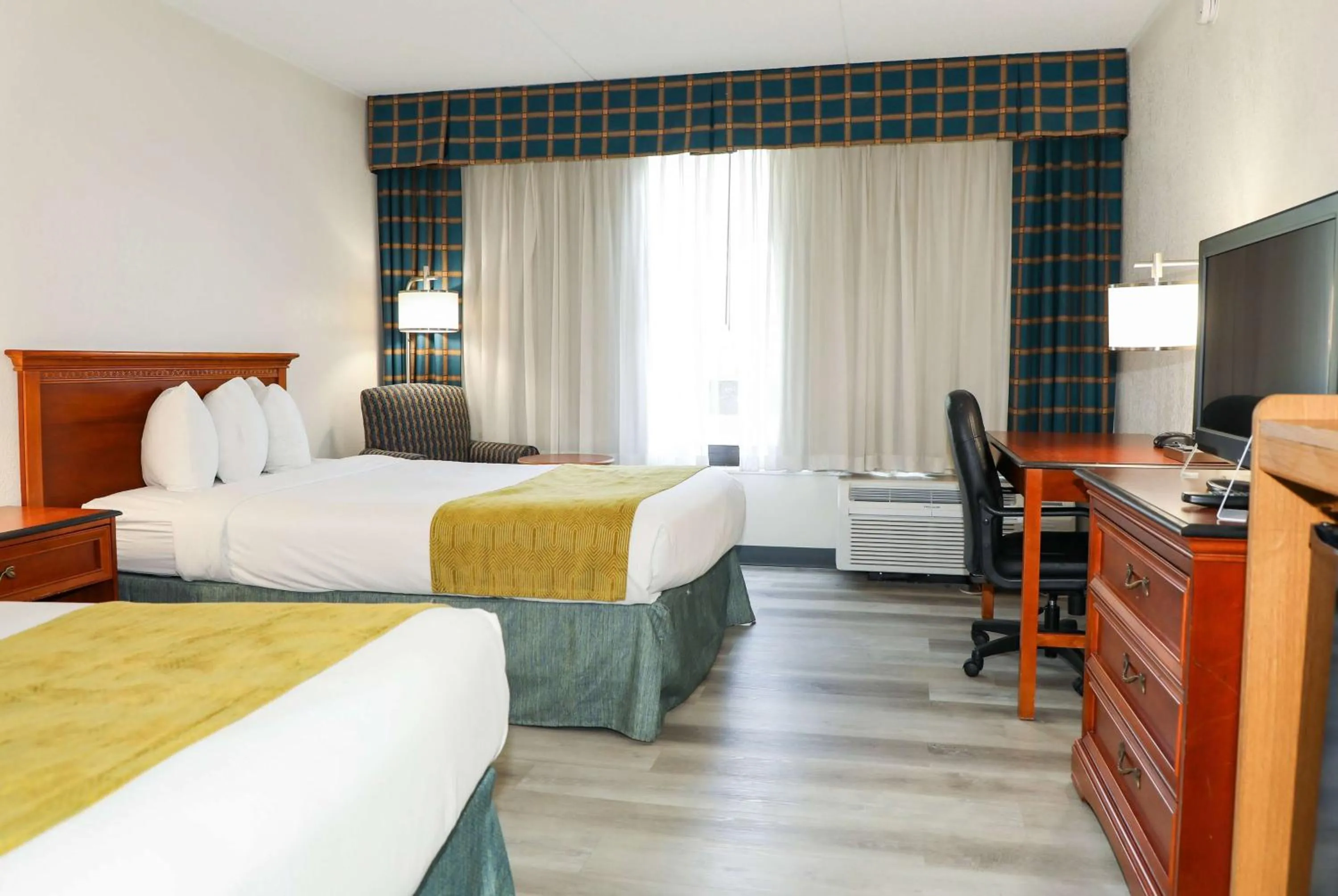 Photo of the whole room, Bed in Ramada by Wyndham Cumberland Downtown