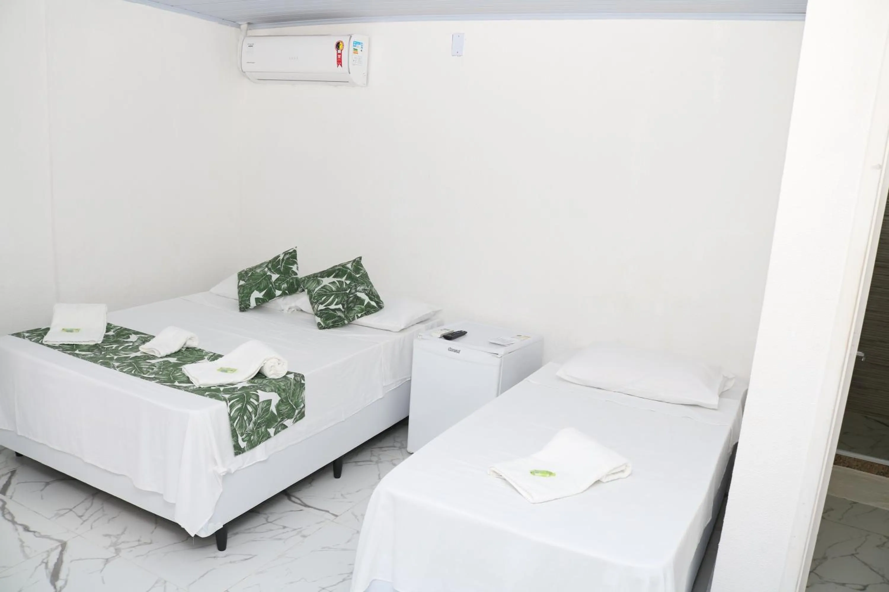 Bed in Pousada Lisamar