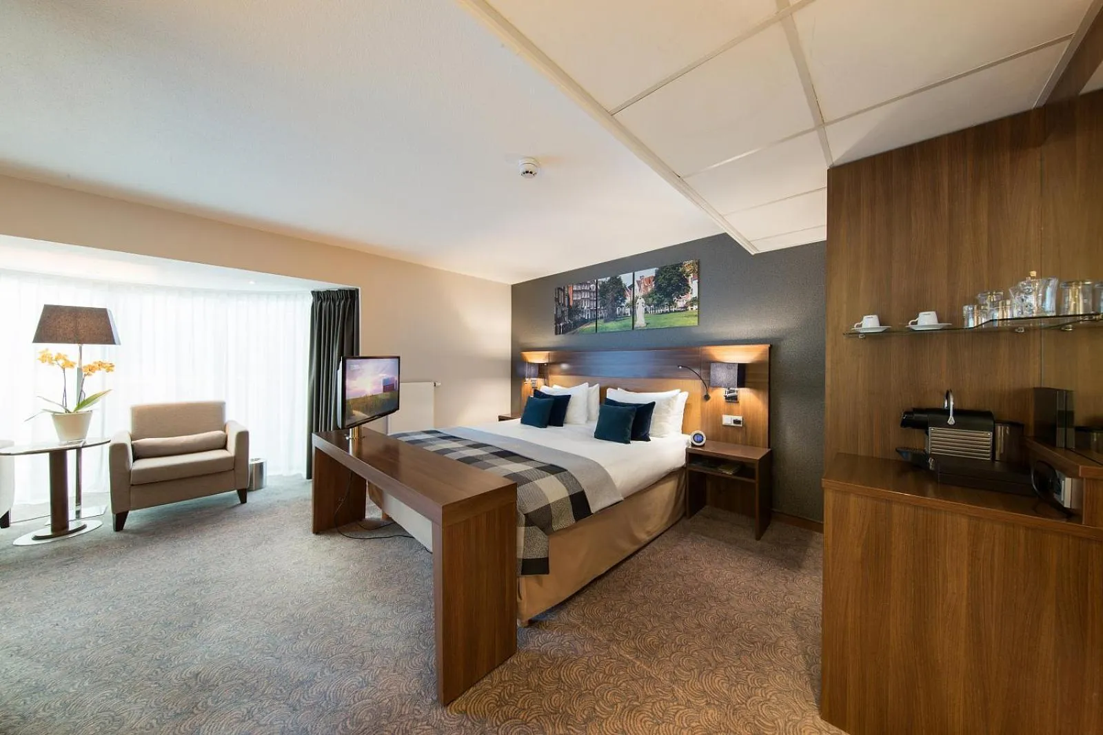 Seating area, Bed in Bilderberg Garden Hotel