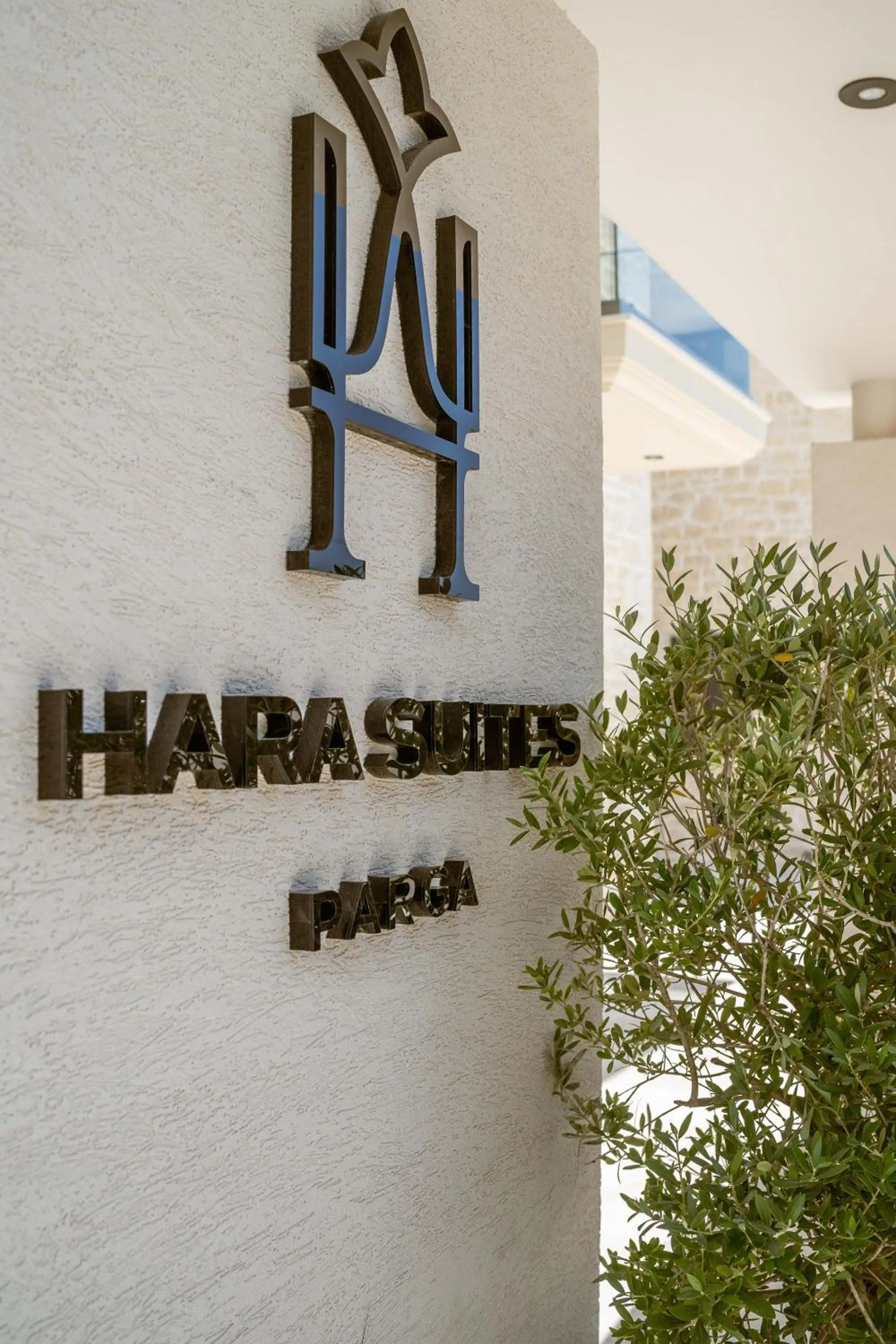 Property logo or sign in Hara Suites