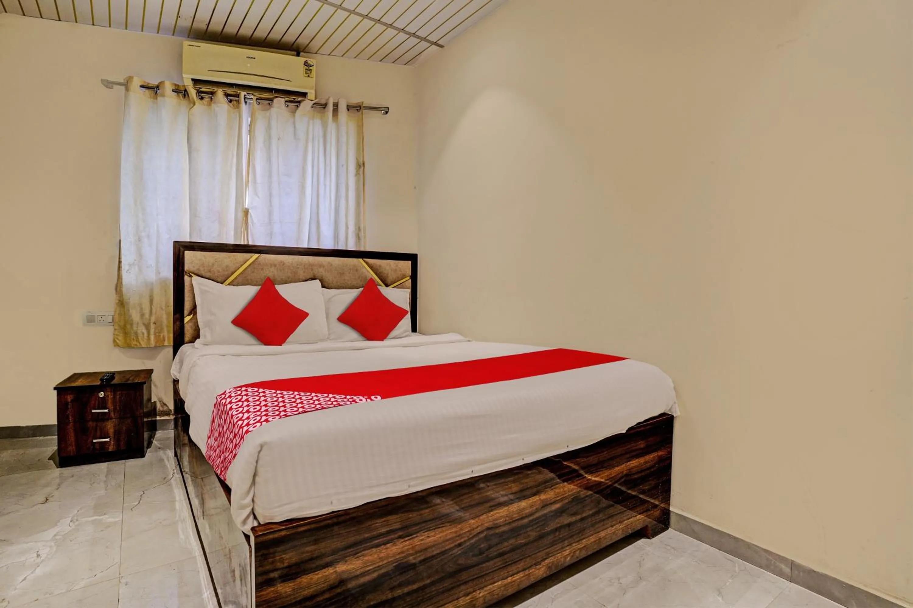 Bedroom in Hotel O NK Grand