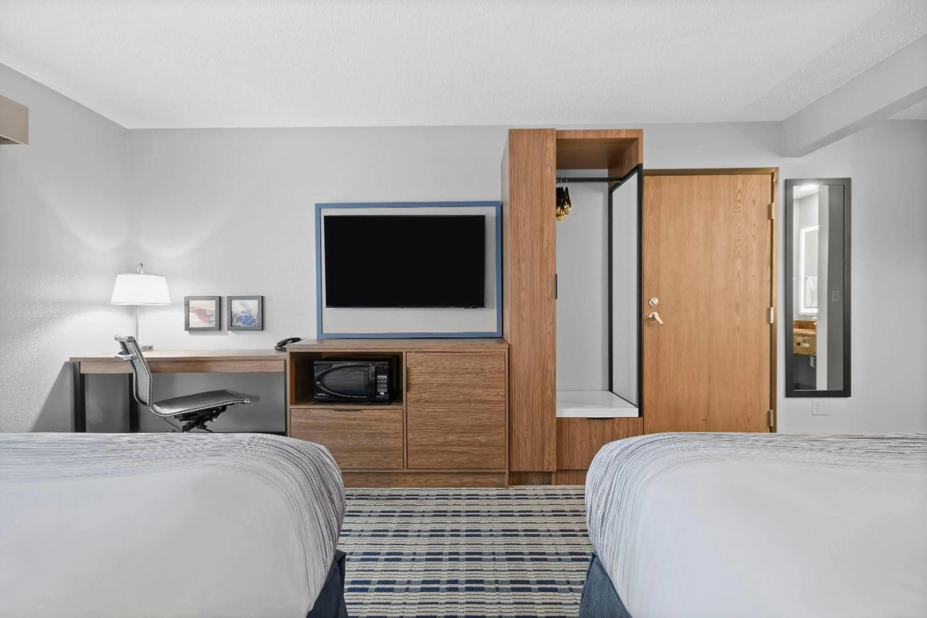 Bed in AmericInn by Wyndham Virginia