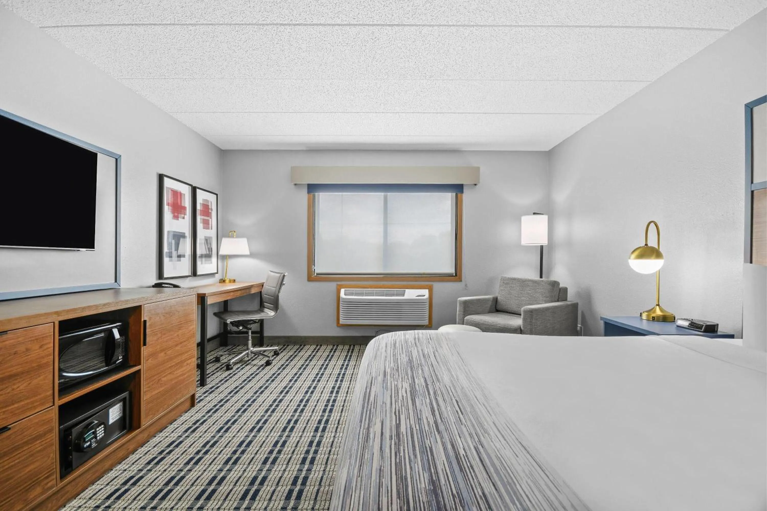 Bed in AmericInn by Wyndham Virginia