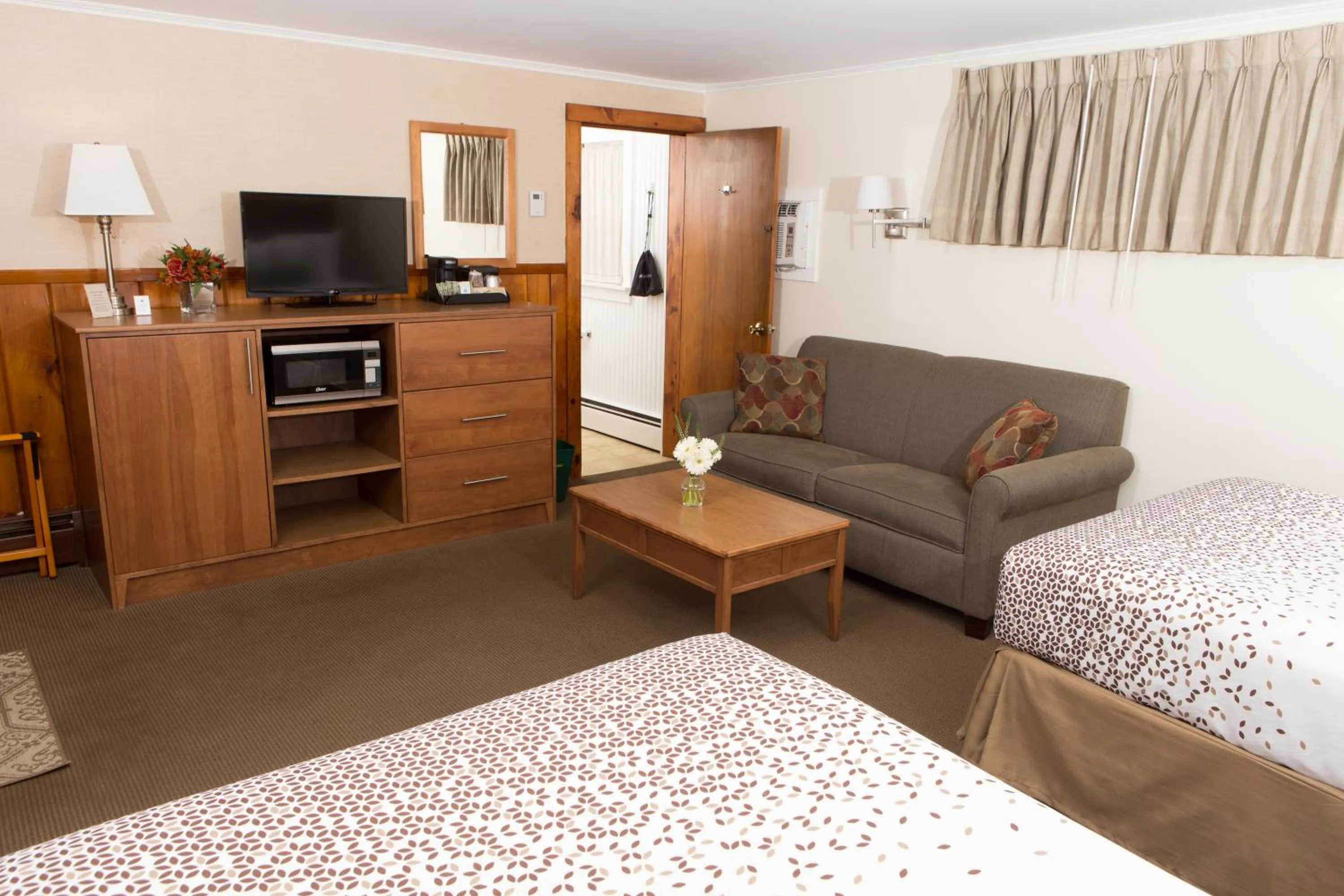 Bed in Knotty Pine Motel