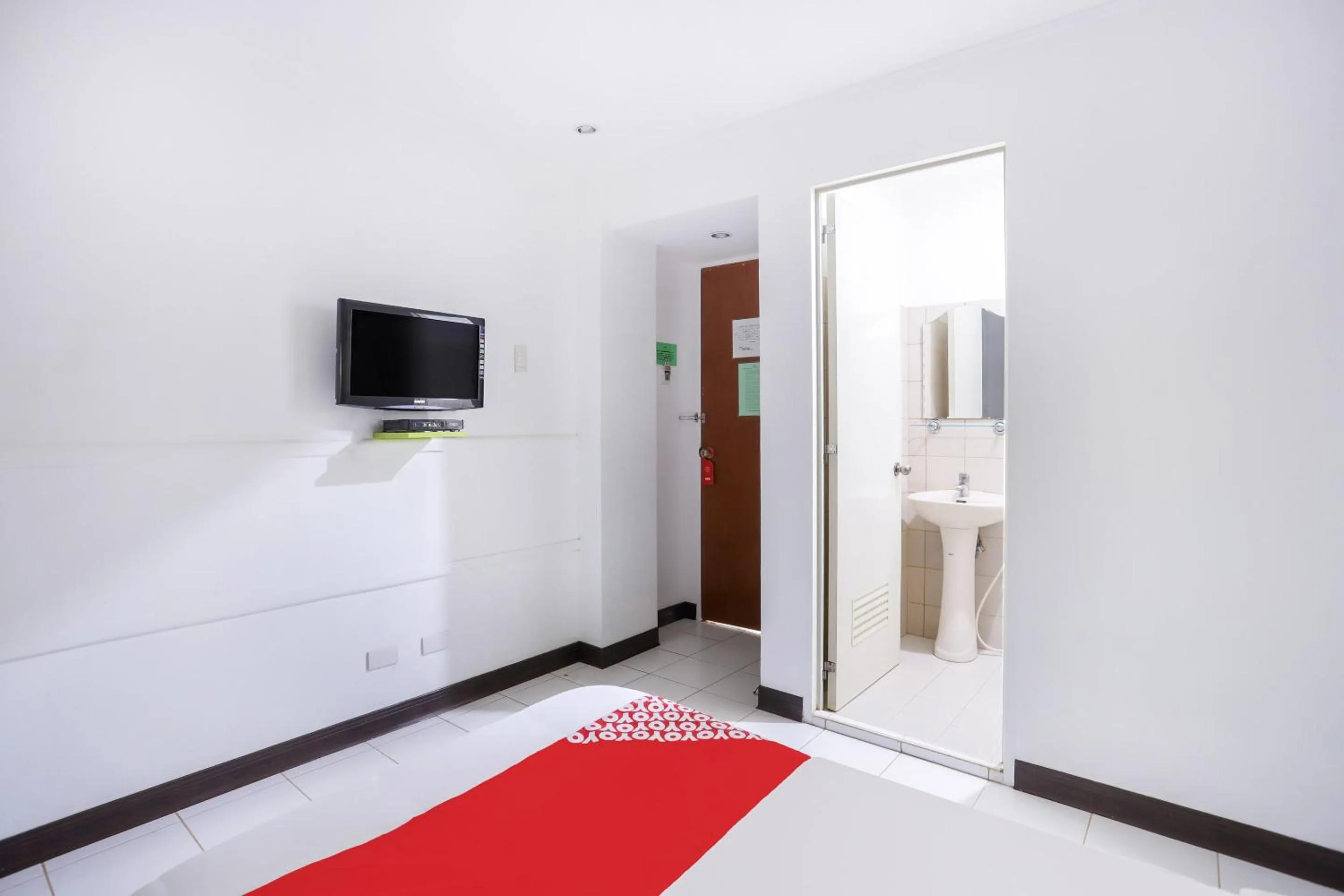 Bedroom in OYO 210 Apple Tree Suites