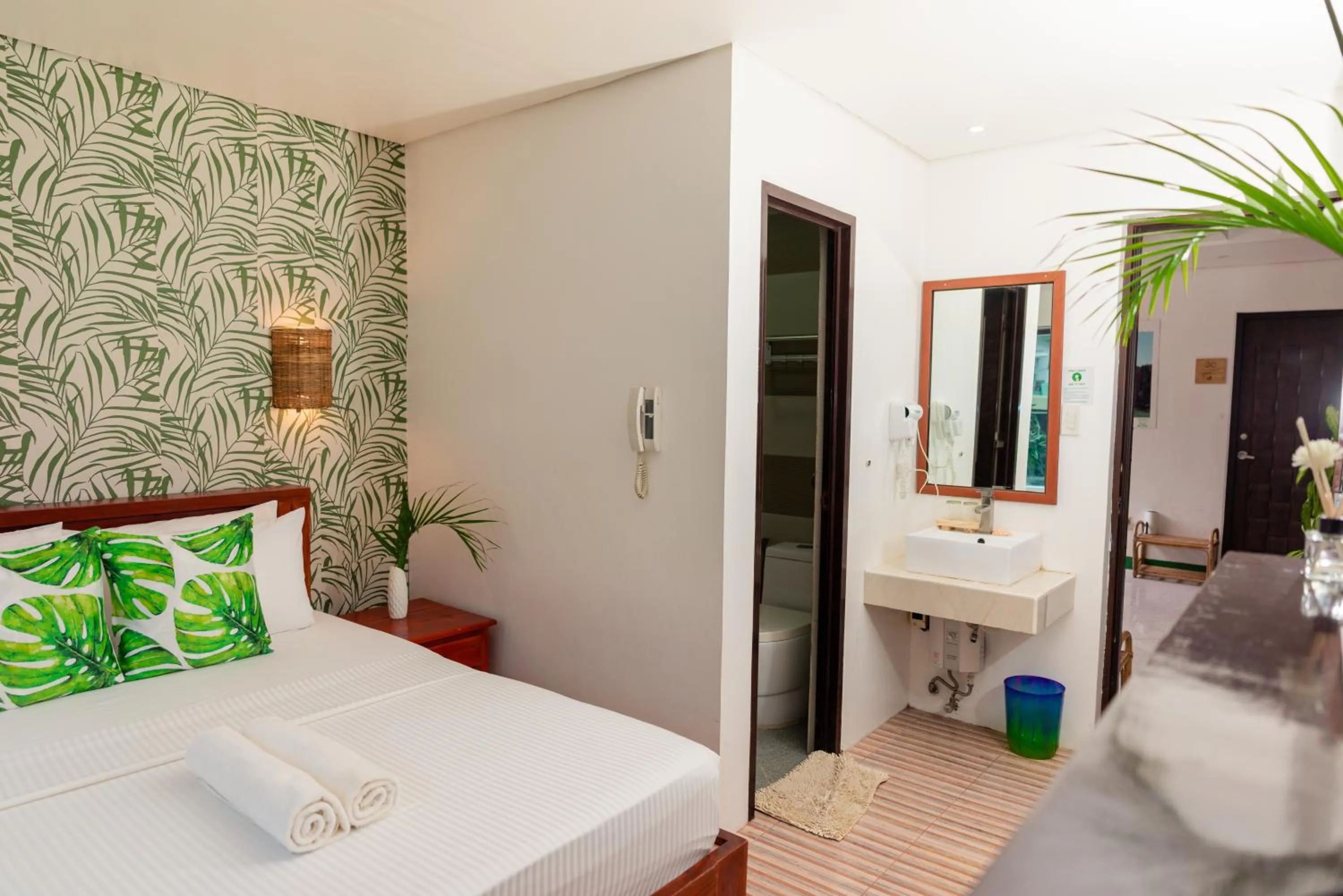 Bed in DENGI INN EL NIDO