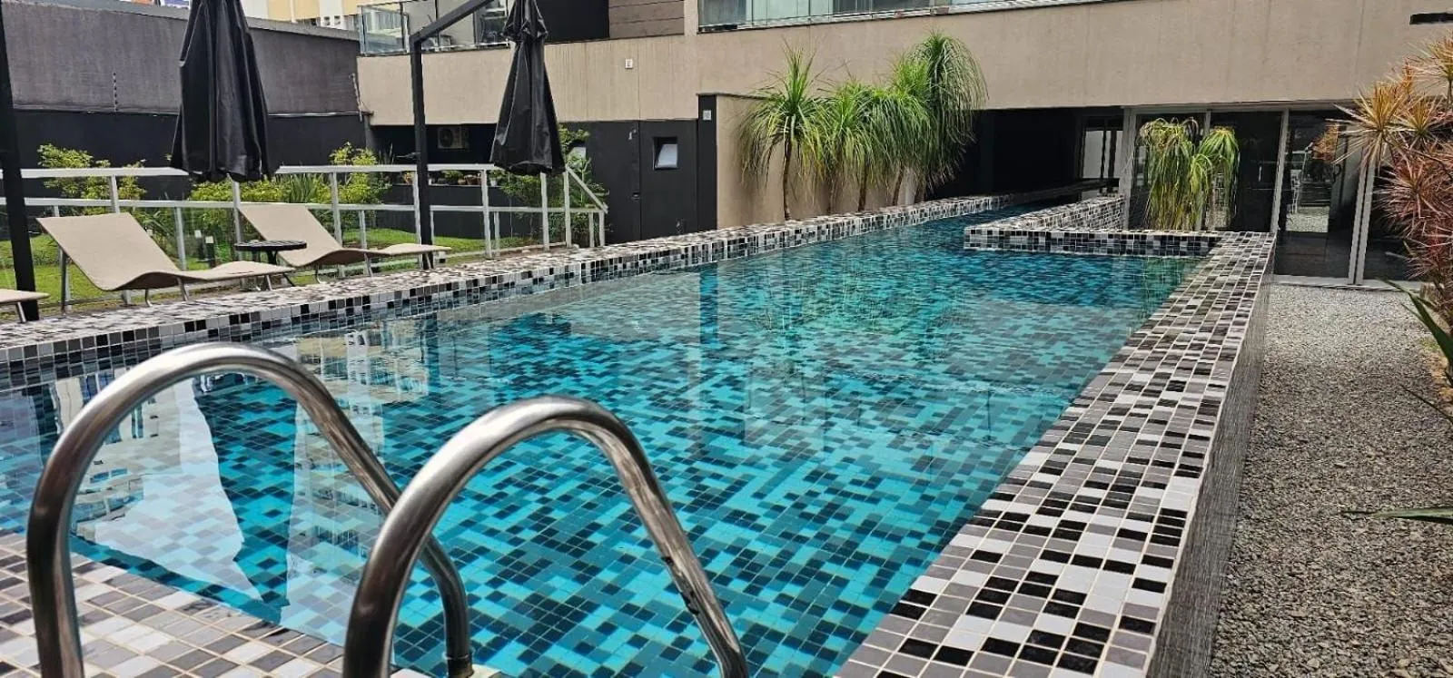 Swimming pool in Loft Completo com Cozinha - Quatá - Vila Olímpia
