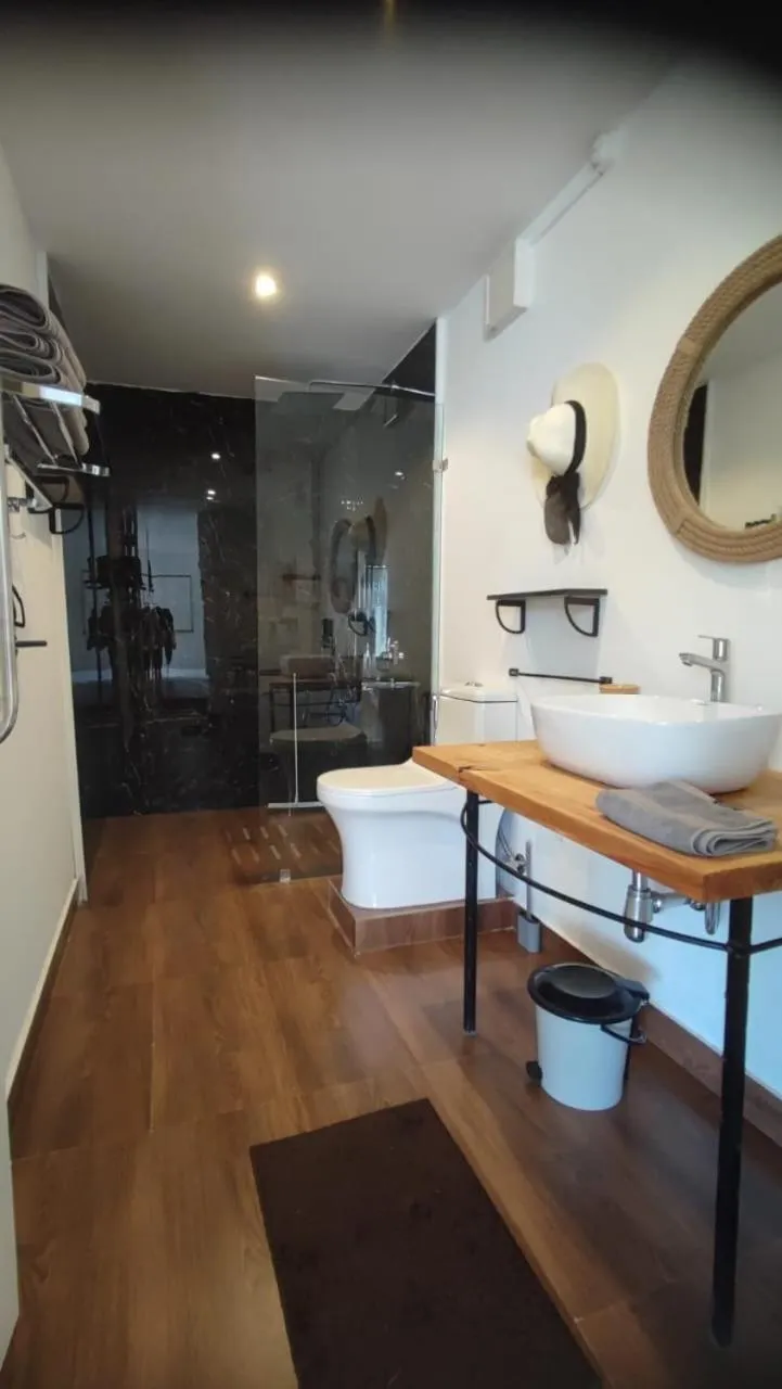 Bathroom in Pont Bleu Suites Riverside & Pool