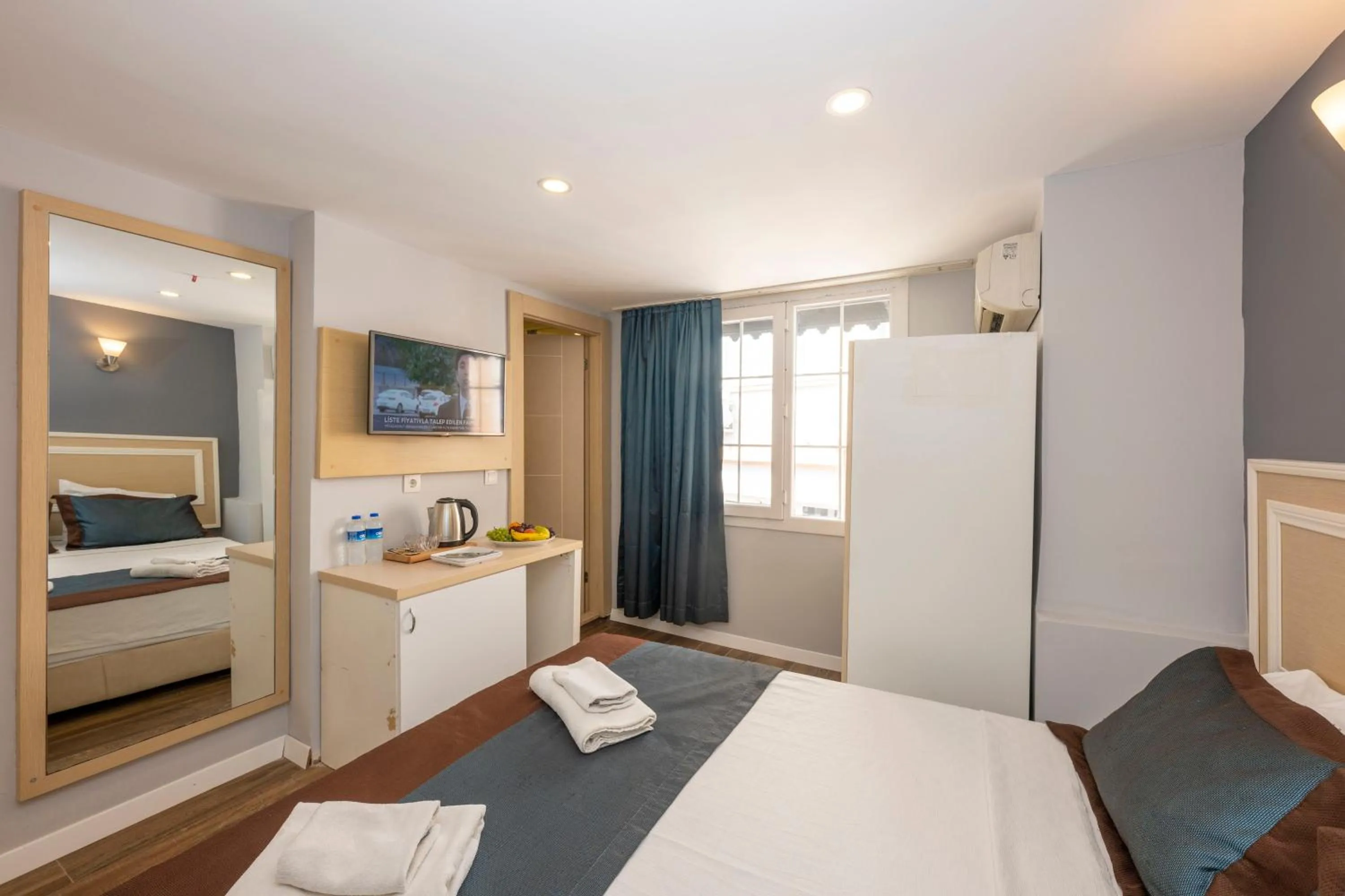 Bed in LEGEND TULIP HOTEL