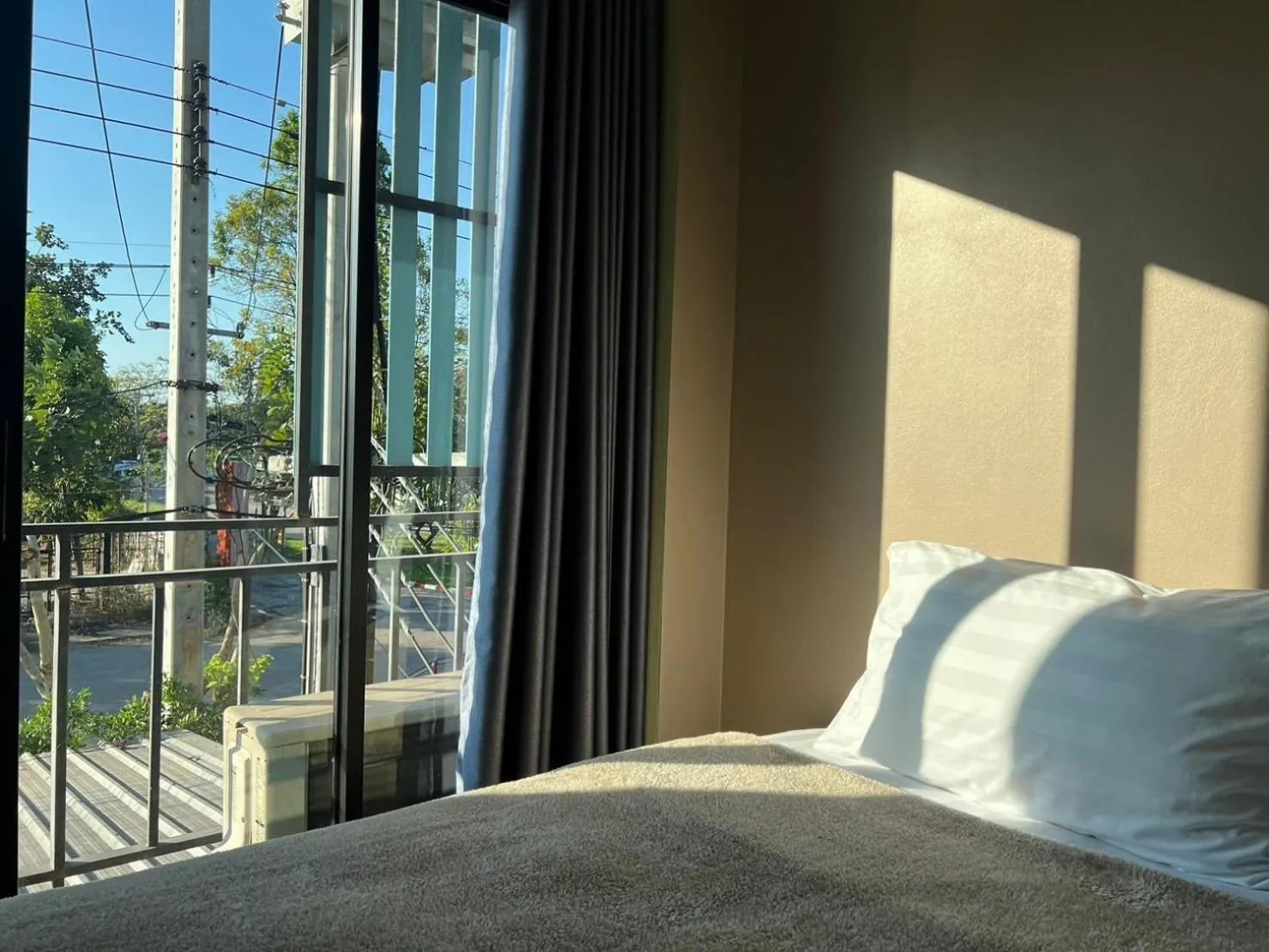 Bed in V Tharm Hotel