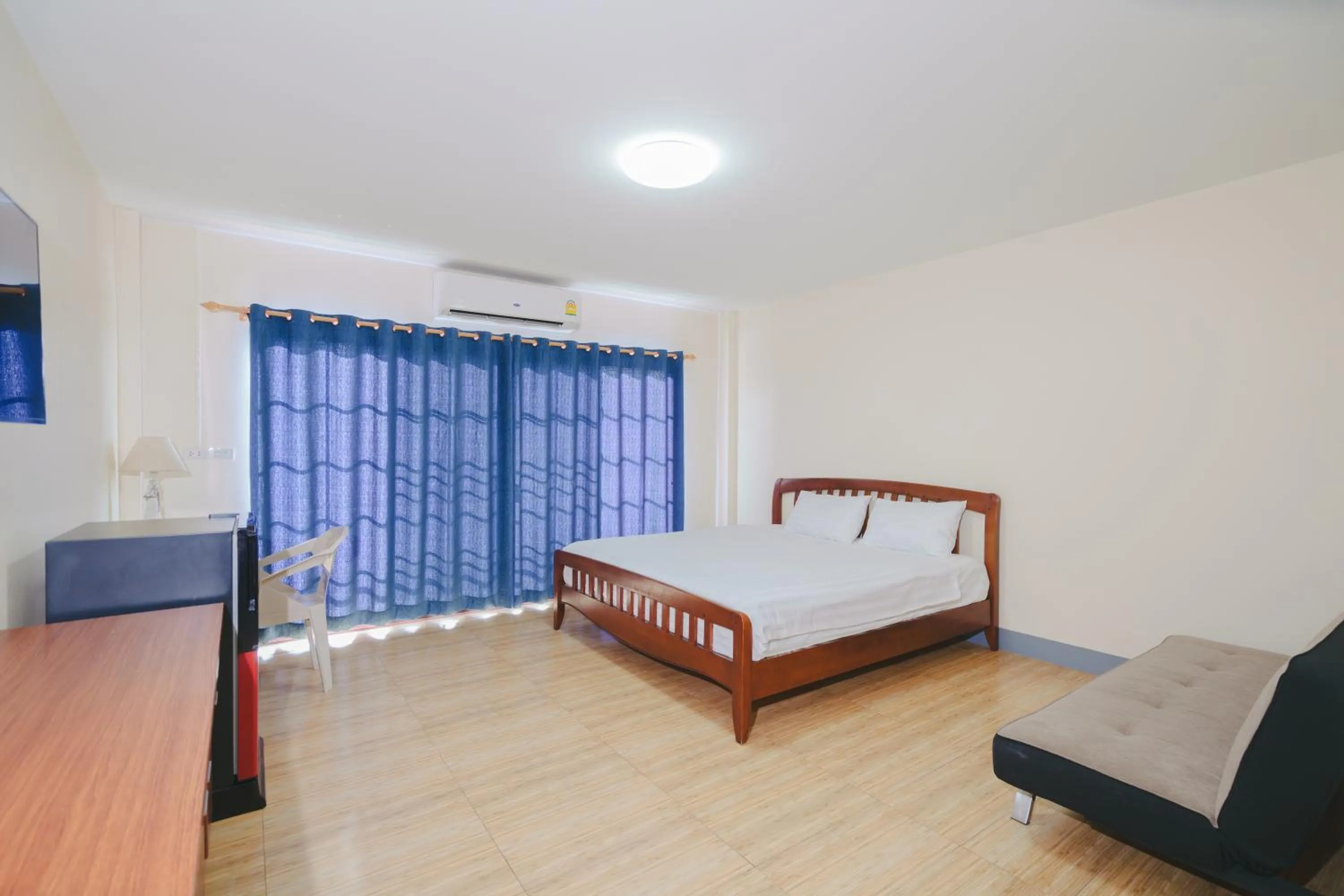 Bed in V Tharm Hotel