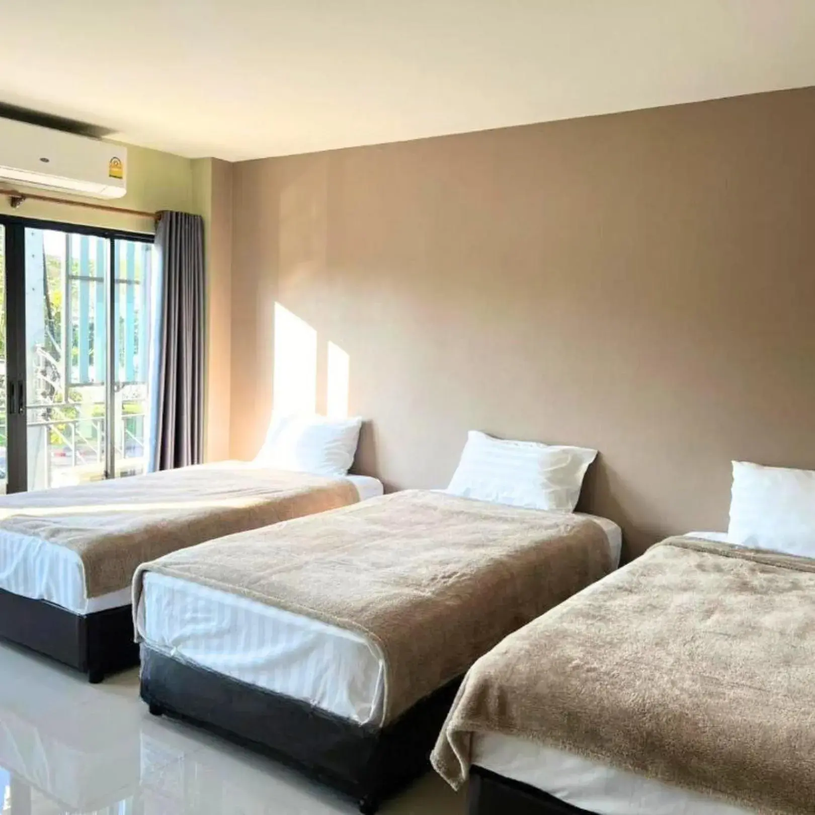 Bed in V Tharm Hotel Bed in V Tharm Hotel