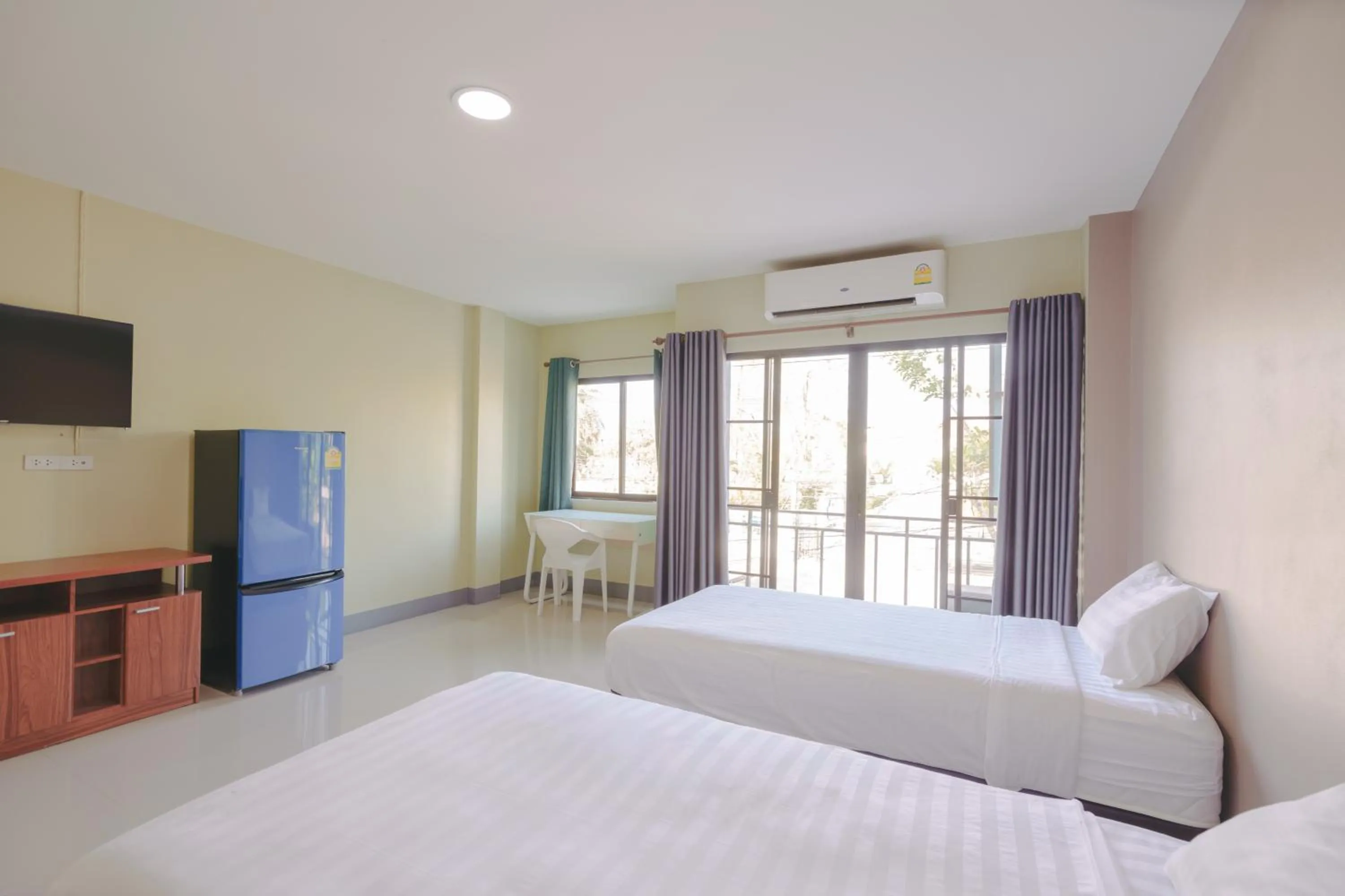 Bed in V Tharm Hotel